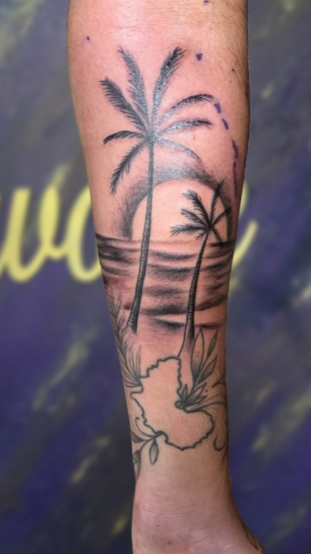 Fine-line palm trees and beach tattoo on forearm