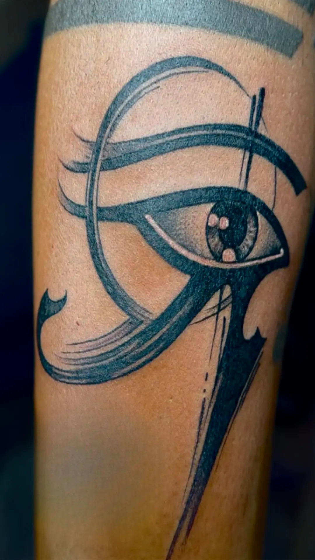 Bold Eye of Horus tattoo on forearm